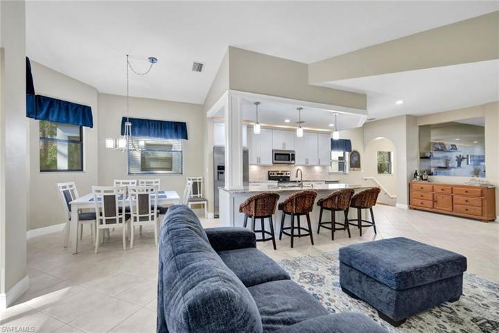 Living room open to kitchen and dining room.