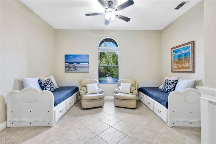 Den offers beautiful views of the lake and water feature.