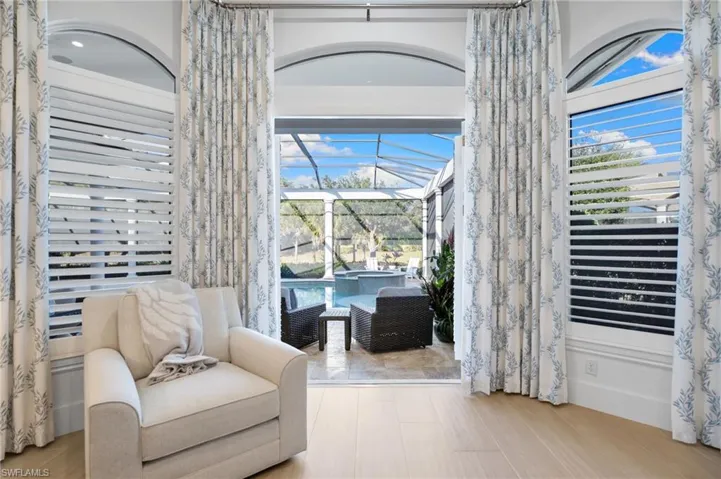 Sitting room featuring a sunroom and plenty of natural light