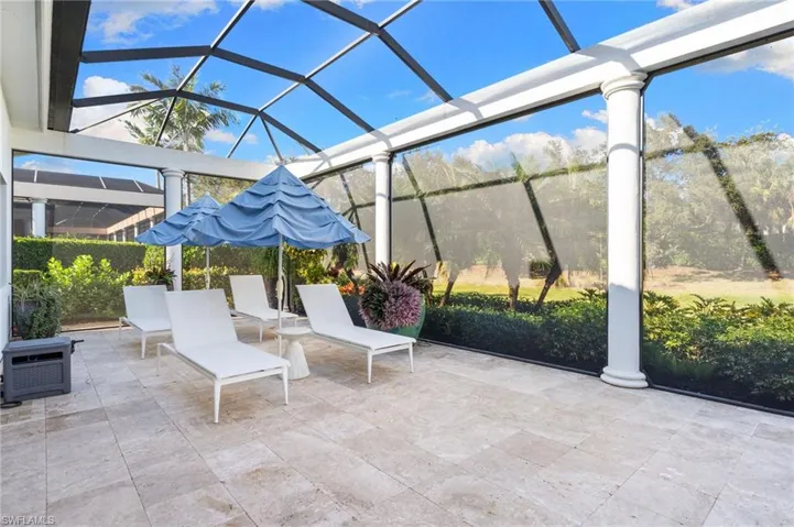 View of patio / terrace featuring a lanai and a sunroom