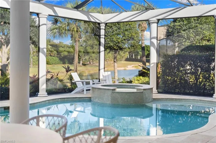 Relaxing pool / spa featuring a patio area