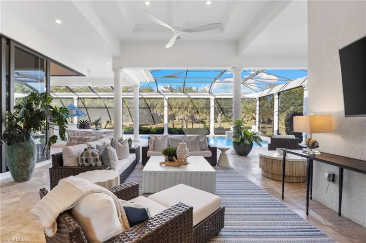 Building lobby with a sunroom, a textured wall, and recessed lighting