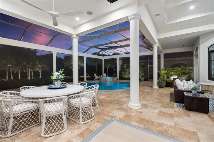 Integrated pool / spa with a lanai, a patio, an outdoor living / dining area, and a sunroom