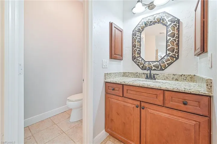 Bathroom featuring vanity and light tile patterned floors