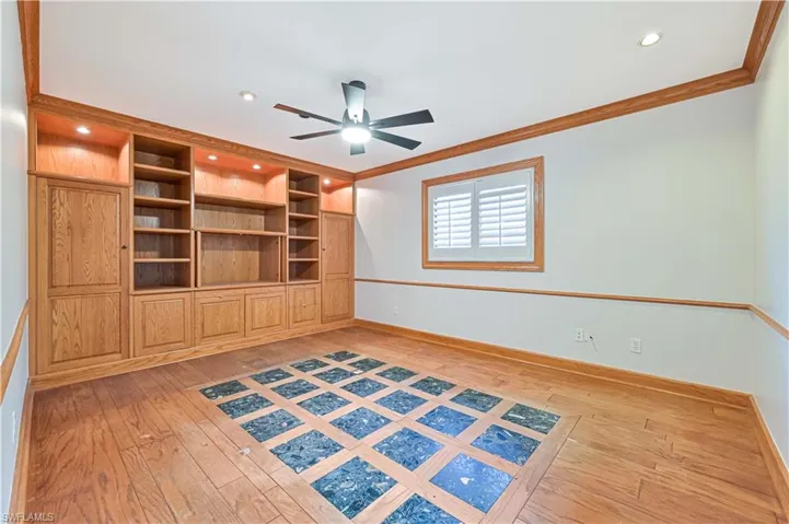 Unfurnished room with light wood-style flooring, ceiling fan, ornamental molding, and recessed lighting