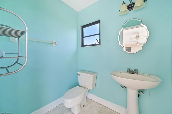 Half bathroom featuring baseboards