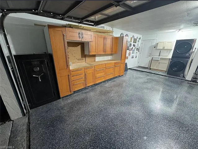Garage with stacked washing machine and dryer