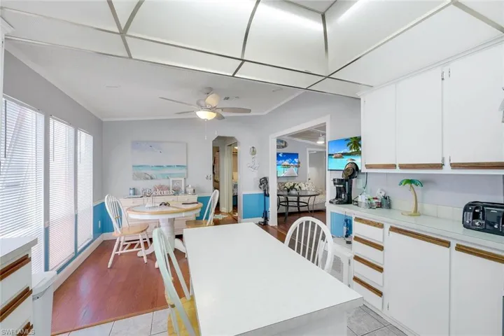 Dining room with light hardwood / wood-style flooring & ceiling fan
