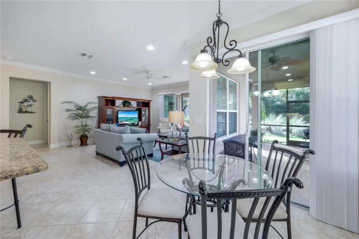 Breakfast nook adjacent to the kitchen with sliders to the lanai.