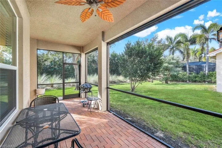 "L" shaped brick paver lanai with access via sliding doors.