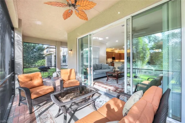 "L" shaped brick paver lanai with access via sliding doors.