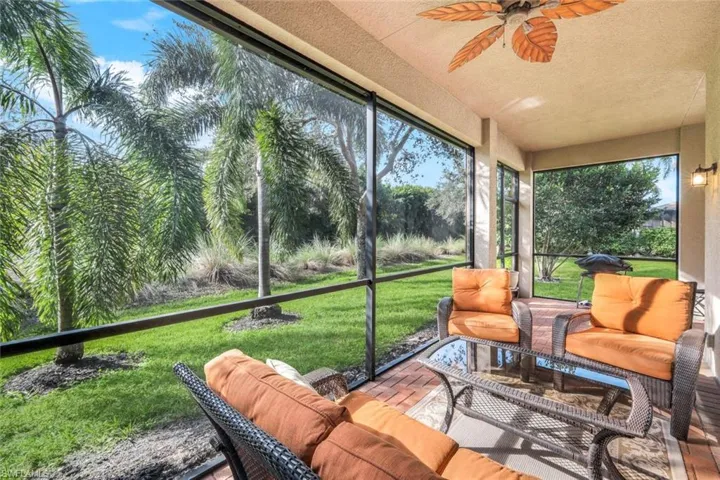 "L" shaped brick paver lanai with access via sliding doors.