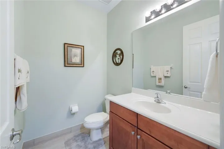 Powder room by laundry.
