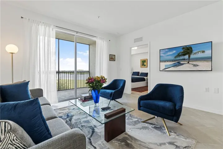 Living area featuring baseboards and tile patterned floors