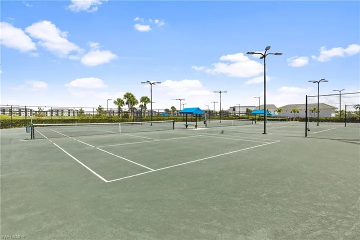 View of tennis court featuring community basketball court