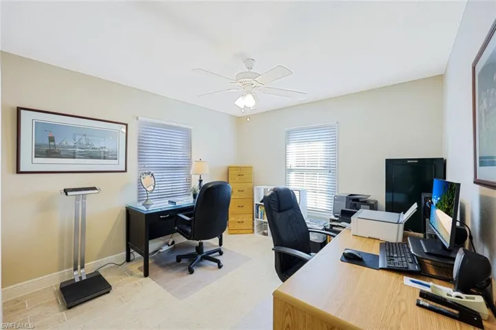 Office featuring ceiling fan and light hardwood / wood-style flooring