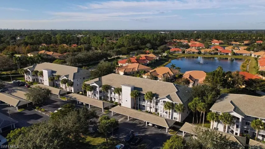 View of property location with a nearby body of water and nearby suburban area