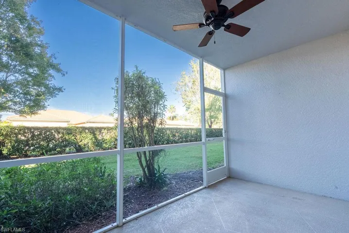 Unfurnished sunroom with a ceiling fan