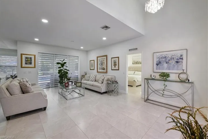 Living area with a chandelier and recessed lighting