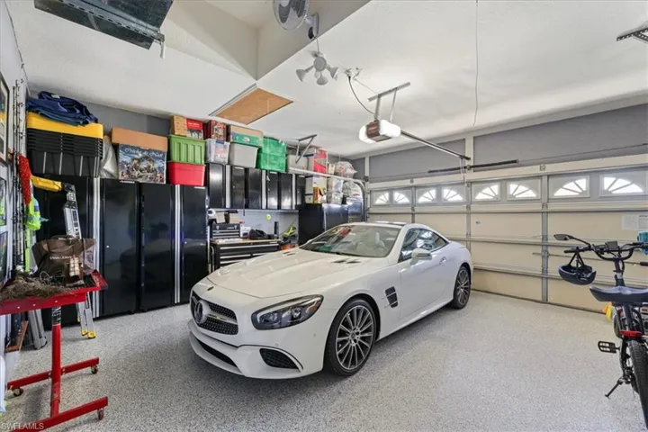Garage featuring a garage door opener