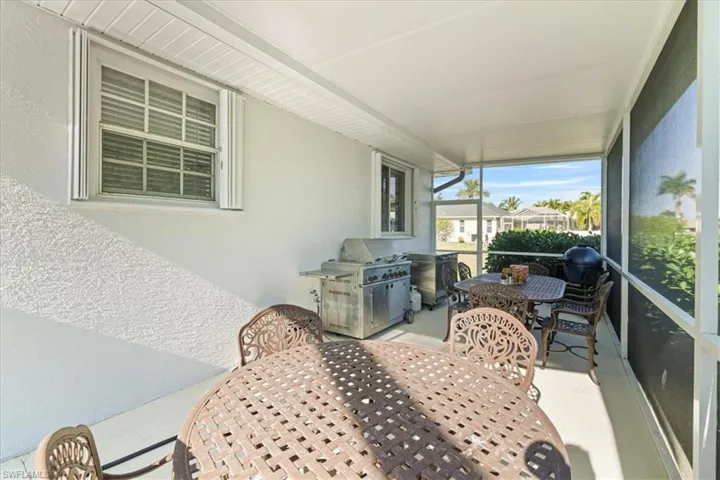Sunroom / solarium featuring outdoor dining space