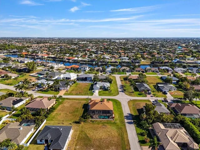 View of property location featuring nearby suburban area and a nearby body of water