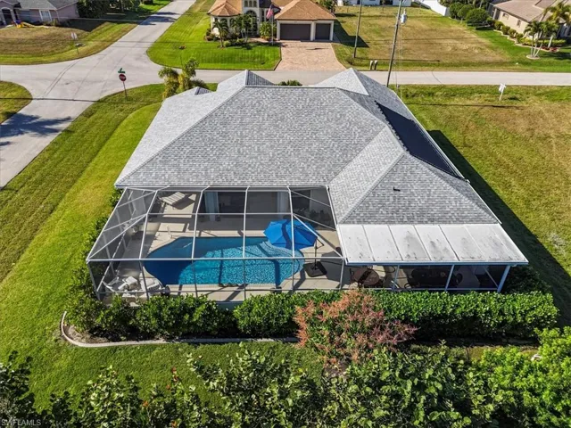 Aerial perspective of suburban area with a pool