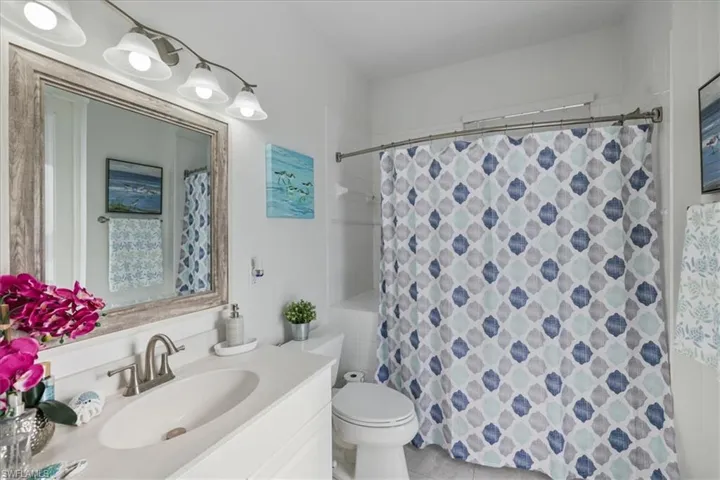 Bathroom with vanity and a shower with shower curtain