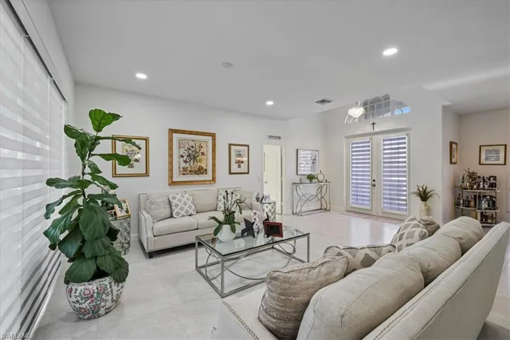 Living room featuring french doors and recessed lighting