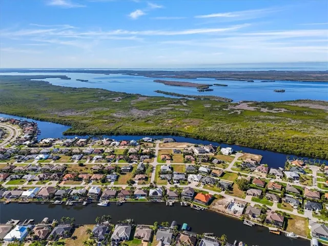 Aerial perspective of suburban area with a large body of water