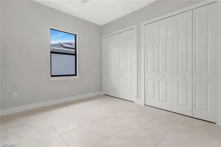 Unfurnished bedroom with two closets
