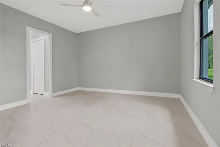 Unfurnished room with ceiling fan