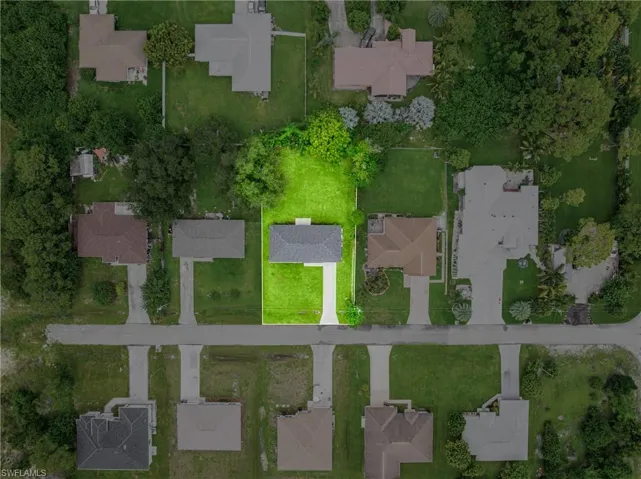 Aerial perspective of suburban area with property boundaries highlighted