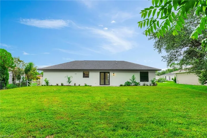 Back of property with stucco siding