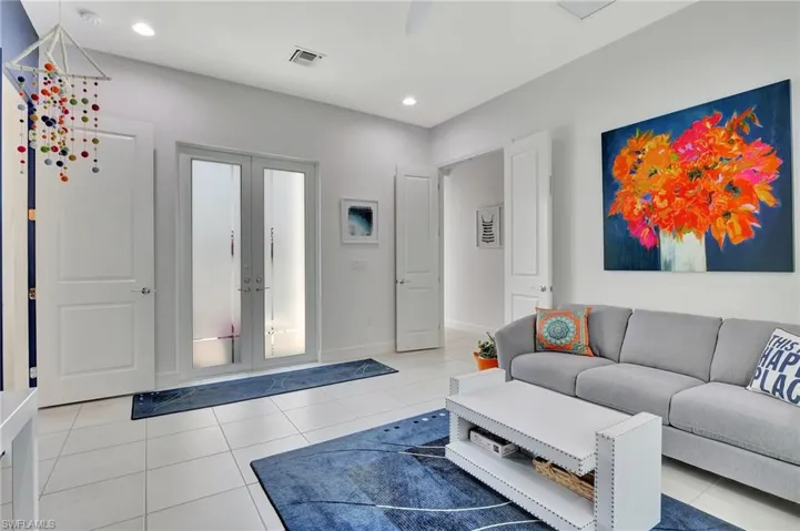 Tiled living room with french doors