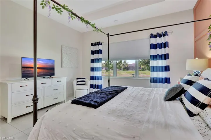 Bedroom featuring light tile floors