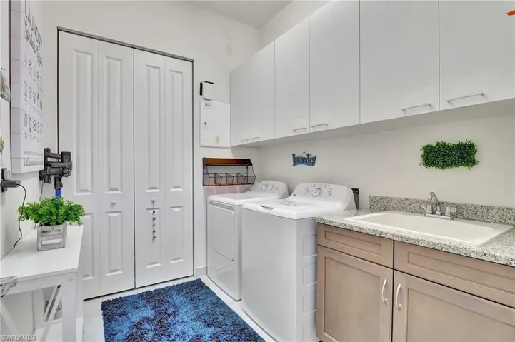 GE Washer/Dryer, built in cabinets, laundry sink, large closet