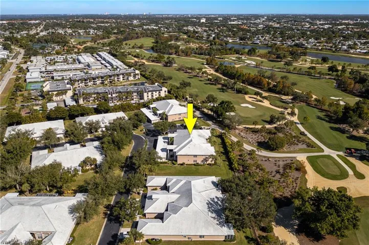 Aerial view of property and surrounding area with a golf course, looking North.