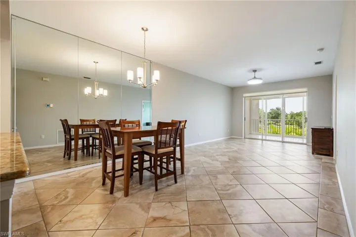 Open Floor plan with combo Dining / Living featuring large sliding glass doors that open to gorgeous golf course views. Upgraded Tile flooring. Recently painted with neutral palette