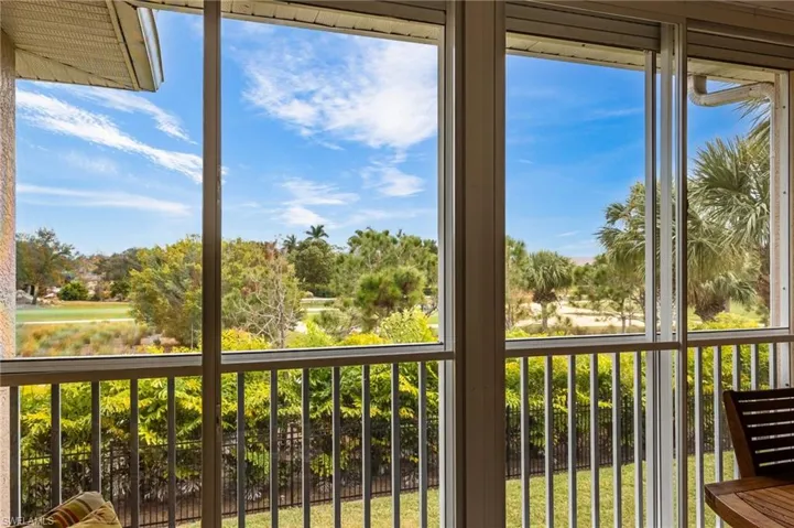 Lanai with Acrylic sliding glass doors to use room in all weather - enjoy lovely views of golf course & mature landscaping.