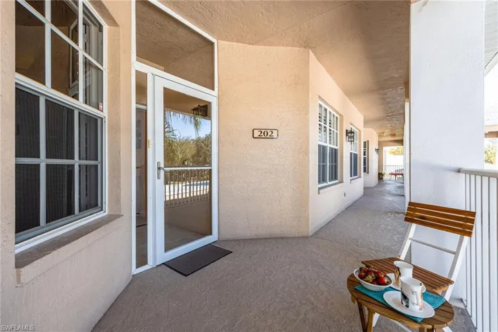 A glassed in front entrance with screened storm door. Covered/protected walkway.