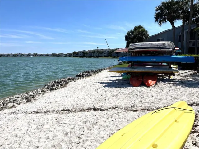 Lake, beach and kayak storage area near community clubhouse & pool.