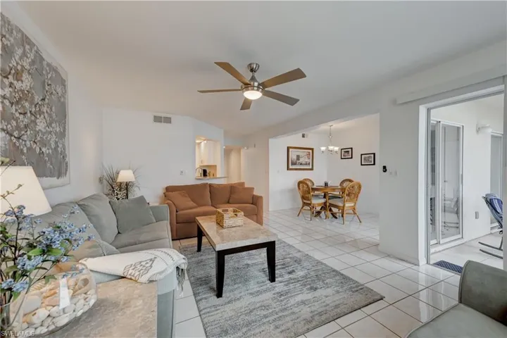 View of family room, dining area, kitchen & foyer.