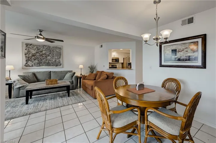 Dining area and family room with views of lake.
