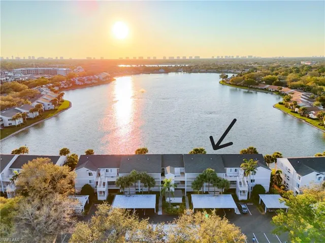 Aerial view of condo building on lake. Less than 4 miles to the beach.