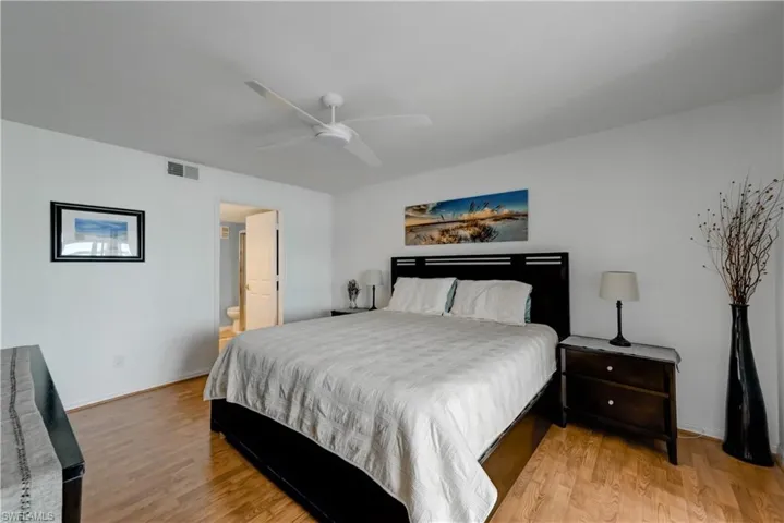 Primary bedroom with king bedroom set.