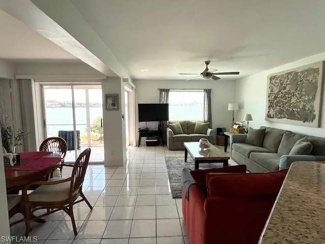 Natural light and views of lake from entry, living and dining areas.