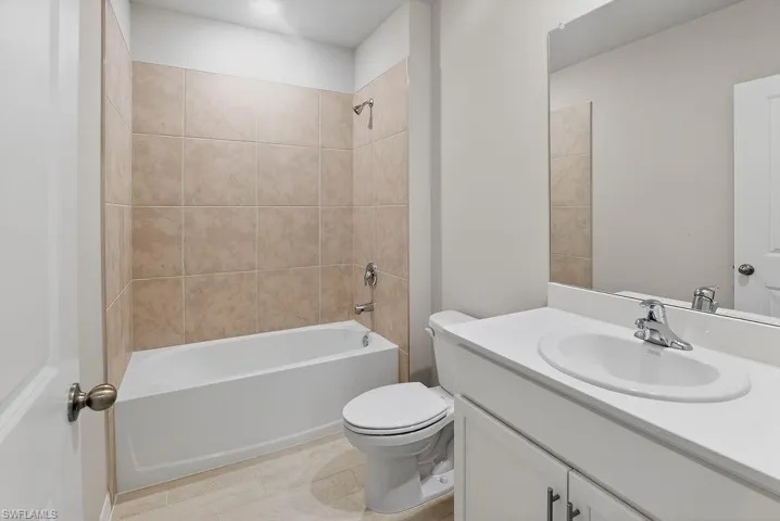 Full bathroom featuring vanity and shower / tub combination