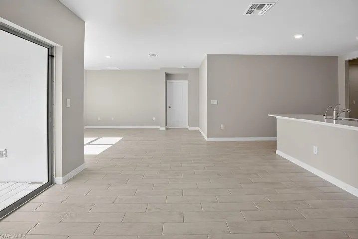 Unfurnished room featuring recessed lighting and wood tiled floors