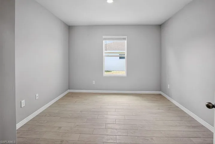 Unfurnished room with light wood-style floors